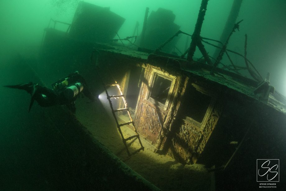 Technical diver exploring shipwreck