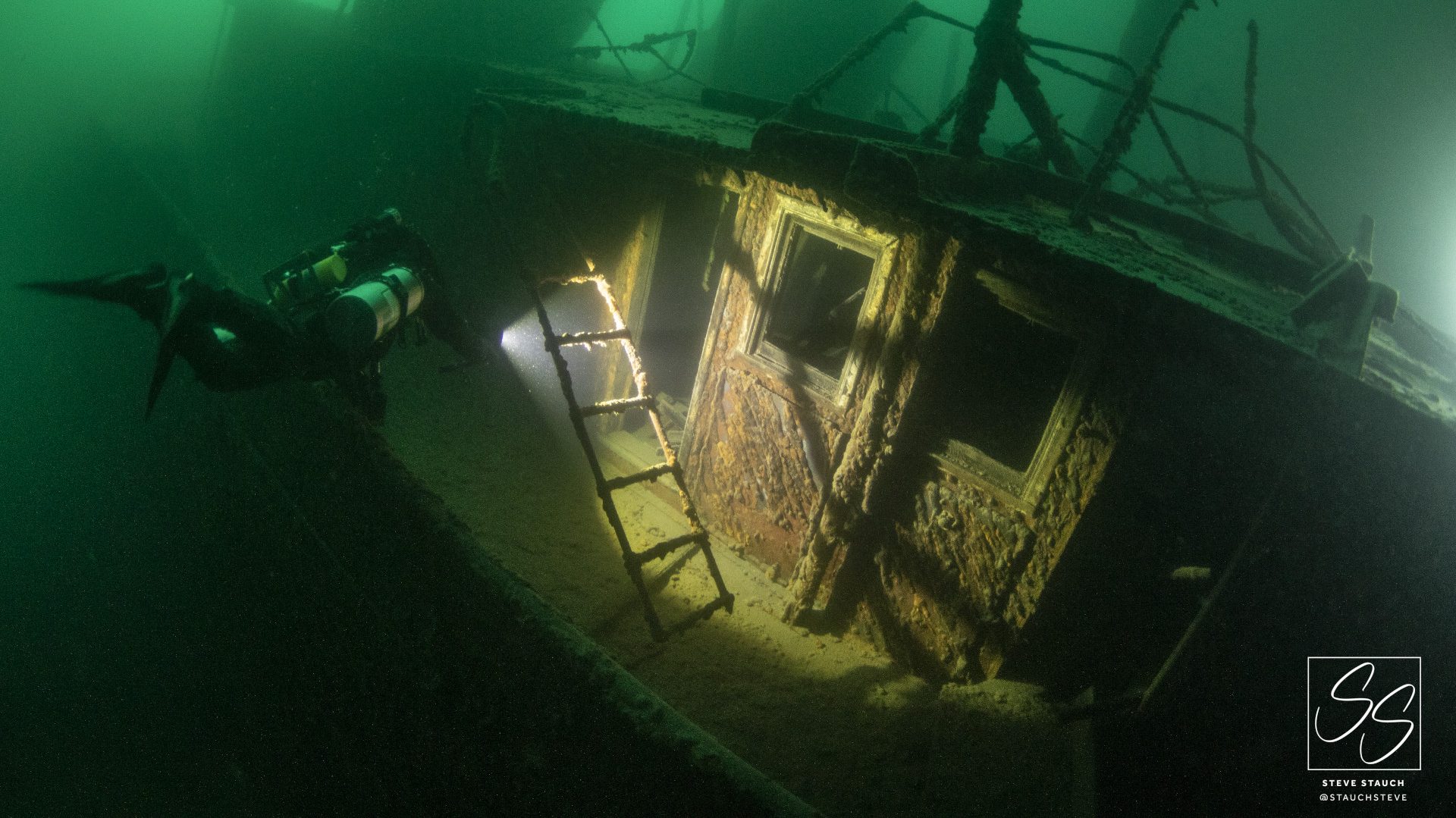 Technical diver exploring shipwreck