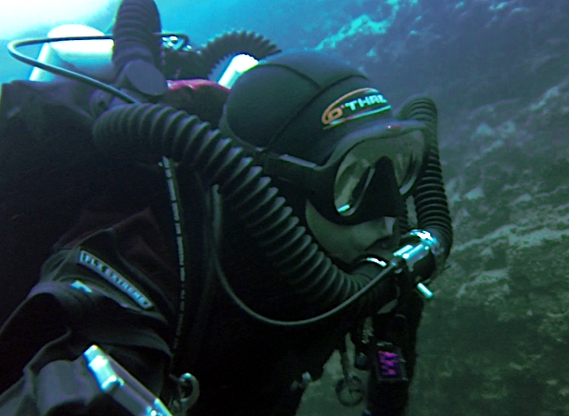 Scuba diver on rebreather underwater.