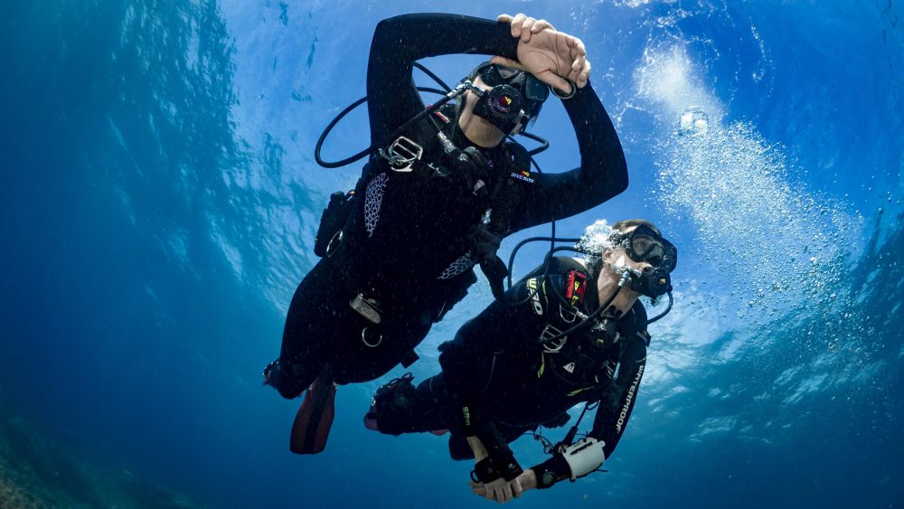 Two scuba divers underwater.